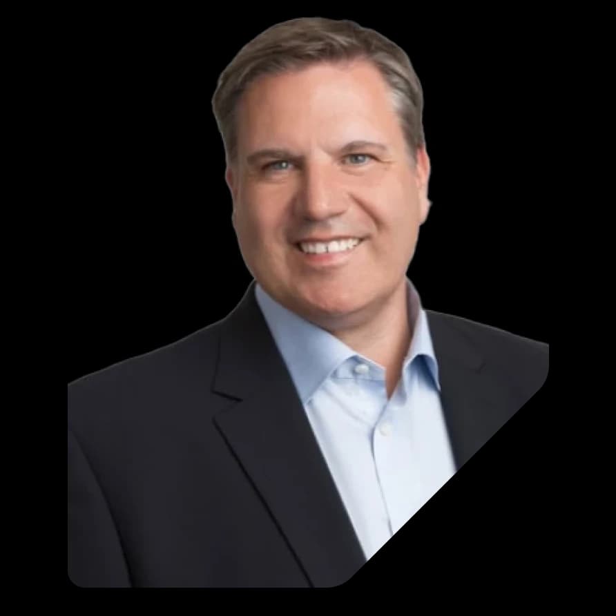 Portrait of Michael Schoner from Riskmethods in a dark suit against a black geometric background